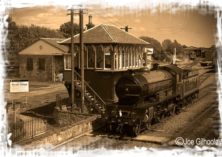 Bo'ness & Kinneil Railway - Morayshire Steam Train at Signal Box - as a sepia tone look. Sight vignetting and art border added on computer