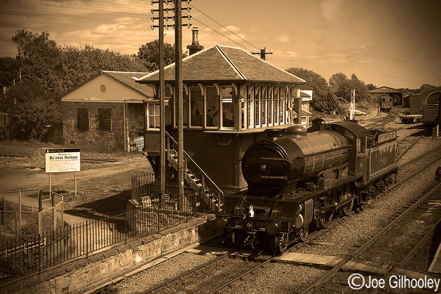 Bo'ness & Kinneil Railway - Morayshire Steam Train at Signal Box - as a sepia tone look. Sight vignetting added on computer