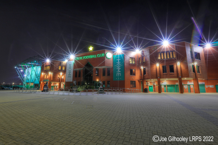 The Front of Celtic Park with the lights on