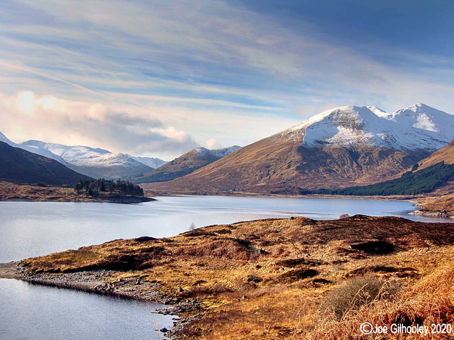 Loch Cluanie with mountain Aonach Meadhoin and Coire na Cadhe to right side. Into Glen Shiel.