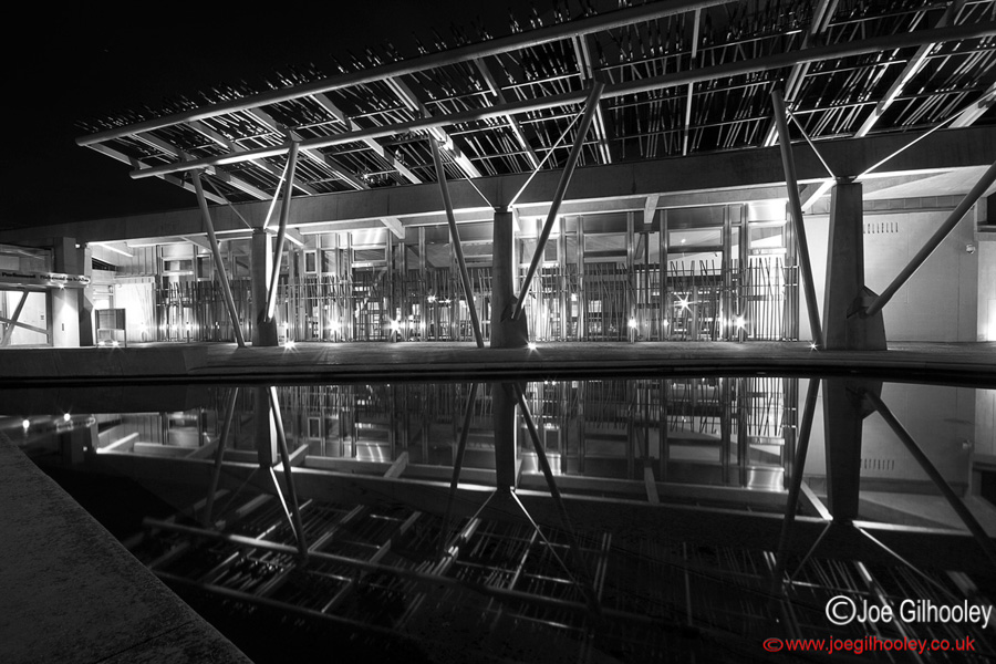 Scottish Parliament at Holyrood at night - reflections in pool 