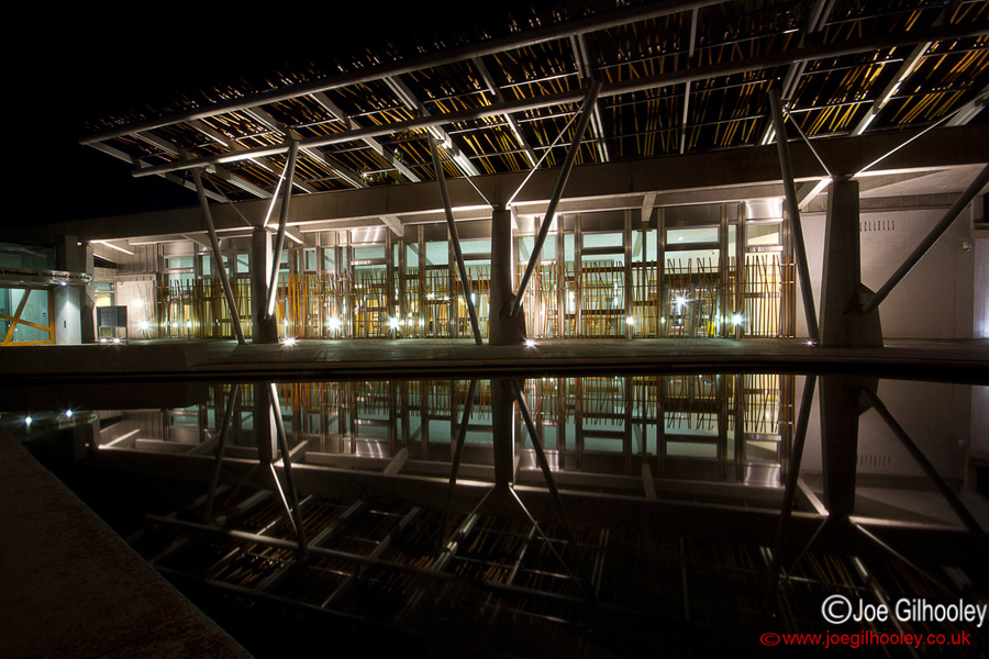 Scottish Parliament at Holyrood at night - reflections in pool 