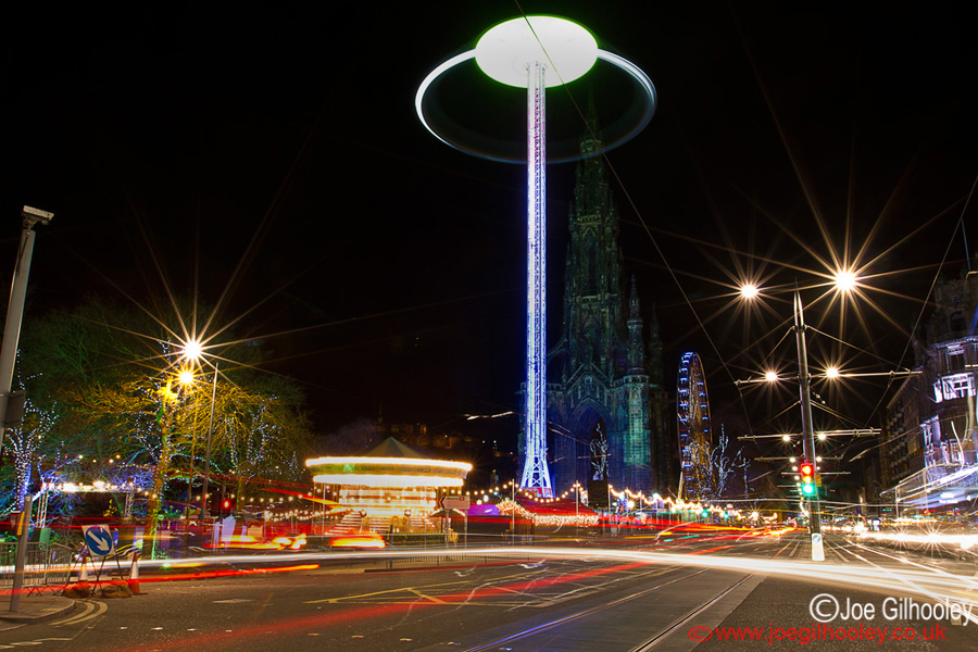 Edinburgh Christmas Attractions 2014 . A view of Princes Street . The Star Flyer with Big Wheel in background