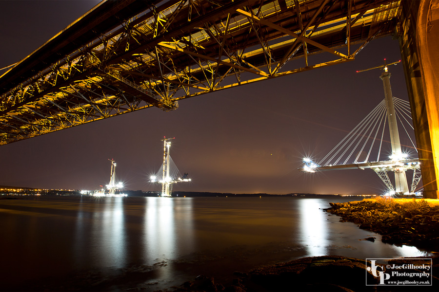 Forth Road Bridge with Queensferry Crossing in background