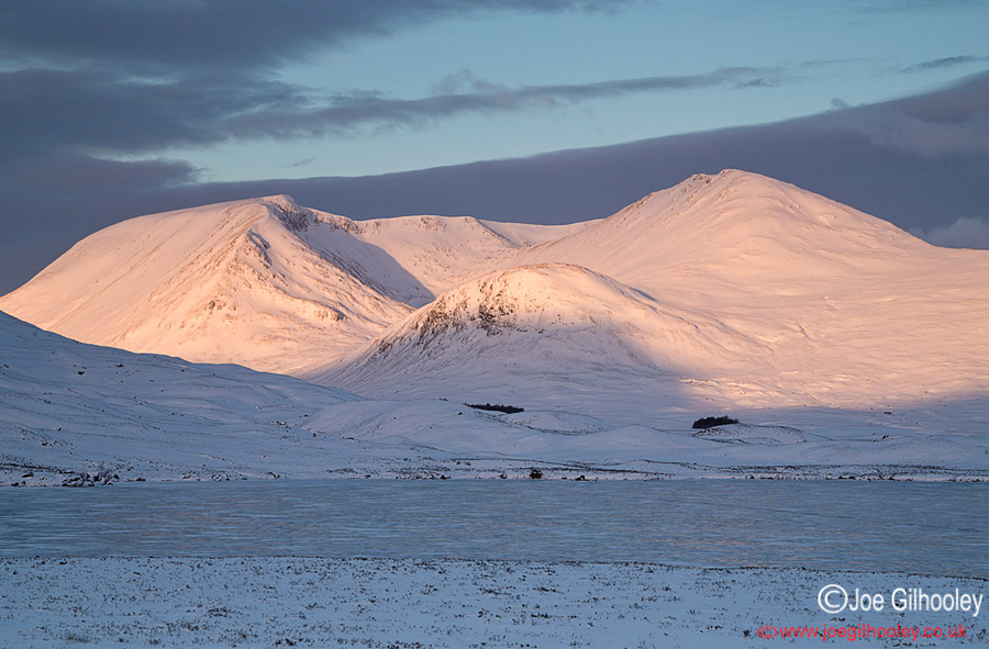 A frozen Lochan na h-Achlaise - the sun was coming up behind my camera shining onto snowy mountains