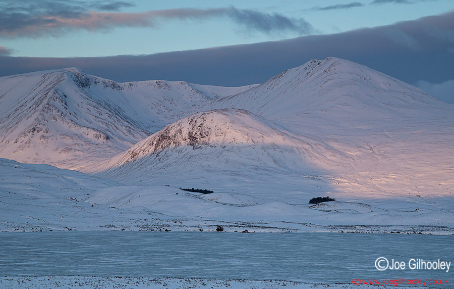 A frozen Lochan na h-Achlaise - the sun was coming up behind my camera shining onto snowy mountains