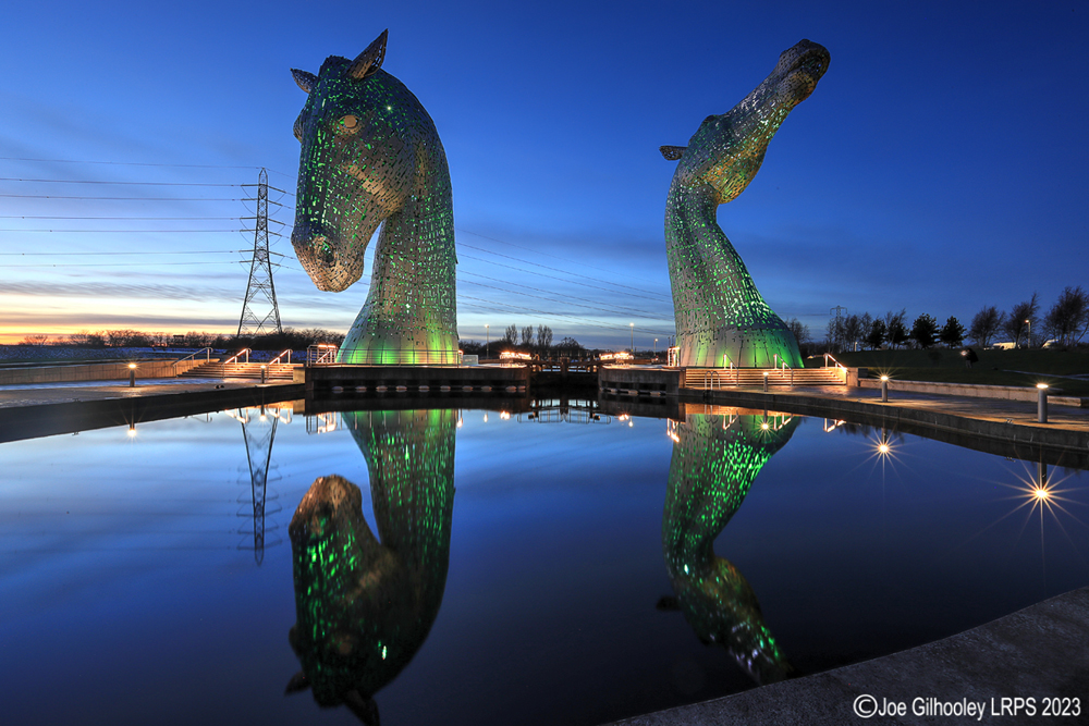 The Kelpies lit at night