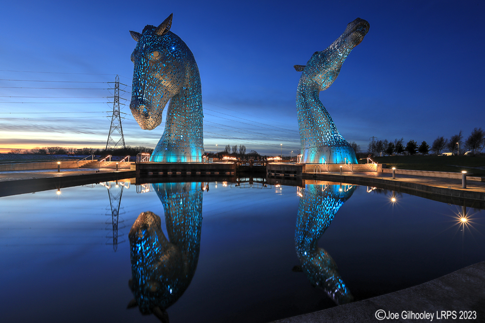 The Kelpies lit at night