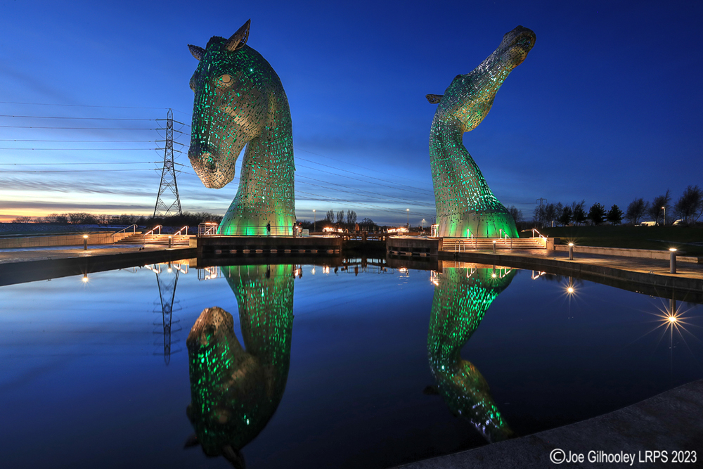The Kelpies lit at night