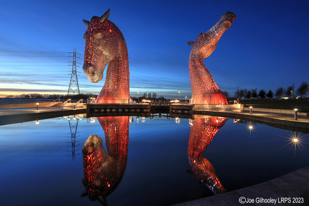The Kelpies lit at night