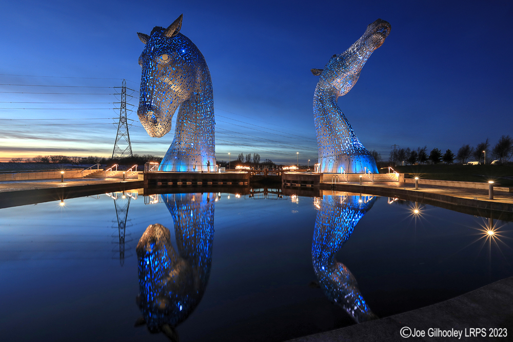 The Kelpies lit at night