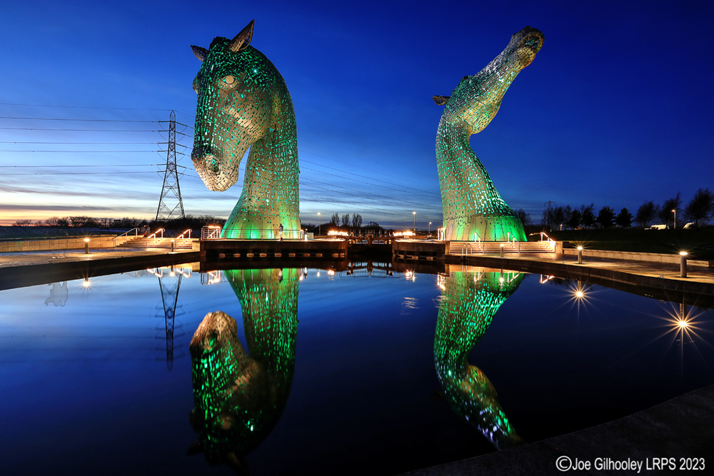 The Kelpies lit at night