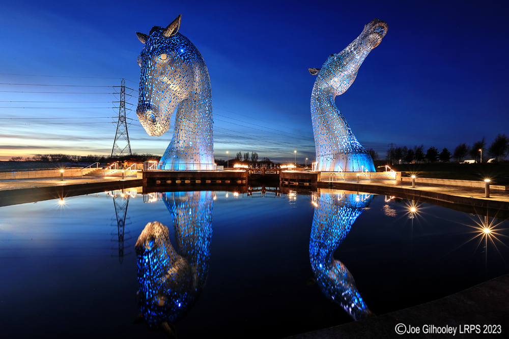 The Kelpies lit at night