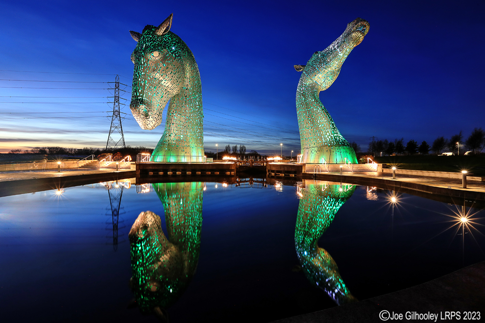 The Kelpies lit at night