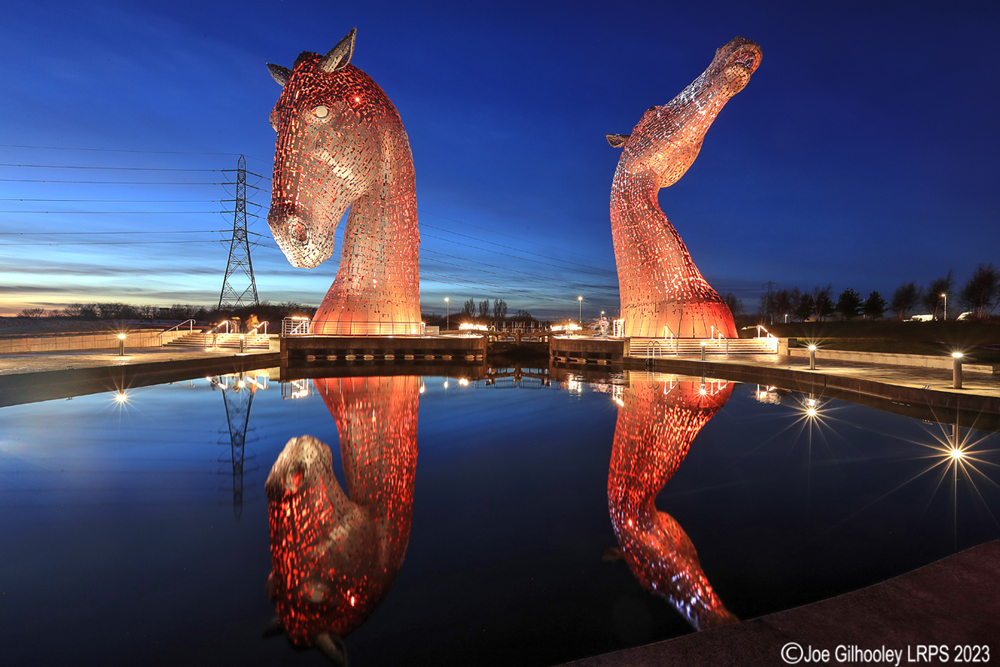 The Kelpies lit at night