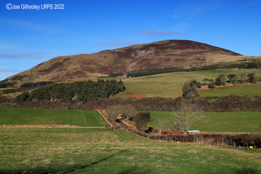 Castlelaw Hill in Pentland Hills with a wonderful winter's blue sky