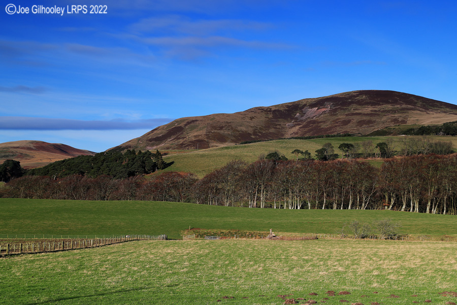 Castlelaw Hill in Pentland Hills with a wonderful winter's blue sky