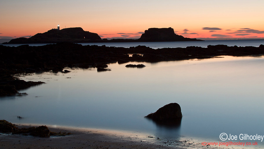 Sunrise at Yellowcraigs Beach. Two hours before dawn. Fidra Island with lighthouse light showing.